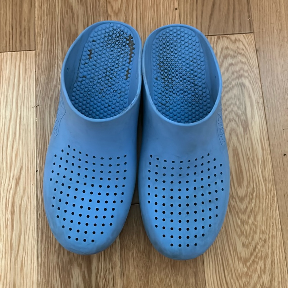 Calzuro light blue clogs with holes